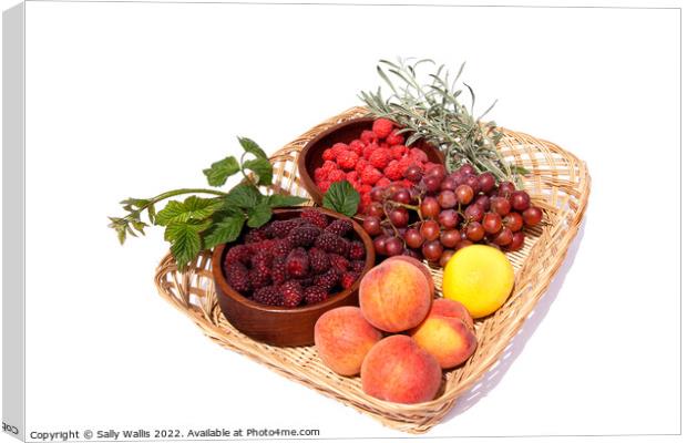 Basket with bowls of fresh fruit Canvas Print by Sally Wallis