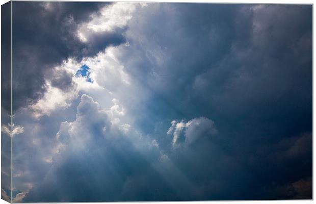 Rays of Sunshine through Clouds Canvas Print by Natalie Kinnear