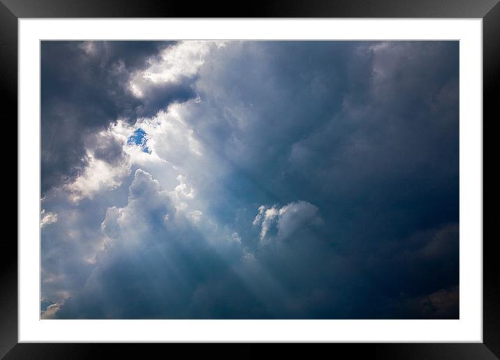 Rays of Sunshine through Clouds Framed Mounted Print by Natalie Kinnear