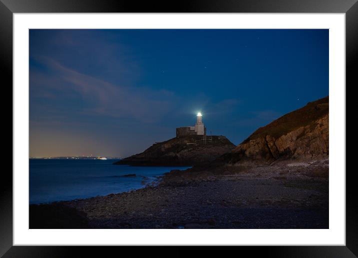 Mumbles lighthouse at night Framed Mounted Print by Bryn Morgan