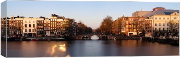 Amstel River and Architecture Amsterdam Netherlands Sunset Canvas Print by Sonny Ryse