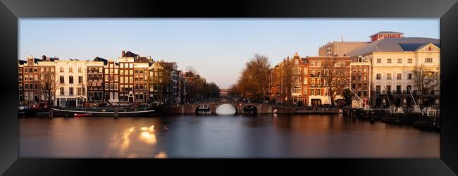 Amstel River and Architecture Amsterdam Netherlands Sunset Framed Print by Sonny Ryse