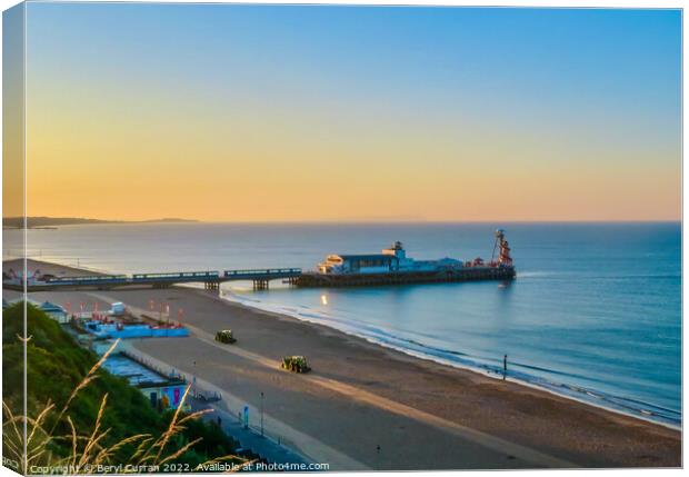 A Glowing Sunrise over Bournemouth Beach Canvas Print by Beryl Curran