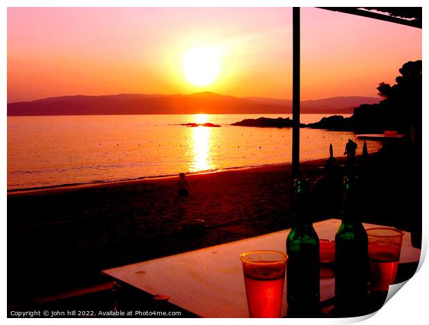 Sunset across the sea at Agia Eleni beach Skiathos, Greece. Print by john hill