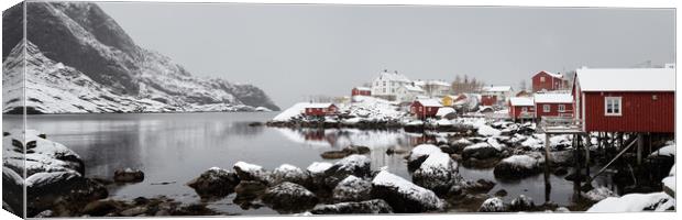 Nusfjord fishing village cabins huts covered in snow Lofoten Isl Canvas Print by Sonny Ryse