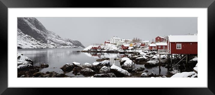 Nusfjord fishing village cabins huts covered in snow Lofoten Isl Framed Mounted Print by Sonny Ryse