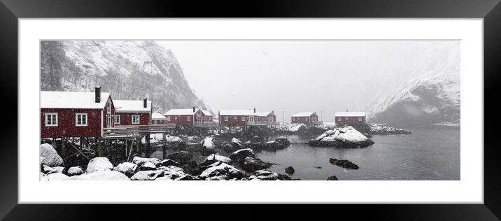 Nusfjord Red cabins huts covered in snow Lofoten Islands in the  Framed Mounted Print by Sonny Ryse