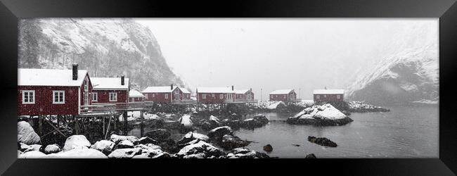 Nusfjord Red cabins huts covered in snow Lofoten Islands in the  Framed Print by Sonny Ryse