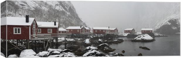 Nusfjord Red cabins huts covered in snow Lofoten Islands arctic  Canvas Print by Sonny Ryse