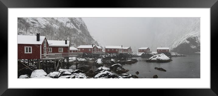 Nusfjord Red cabins huts covered in snow Lofoten Islands arctic  Framed Mounted Print by Sonny Ryse