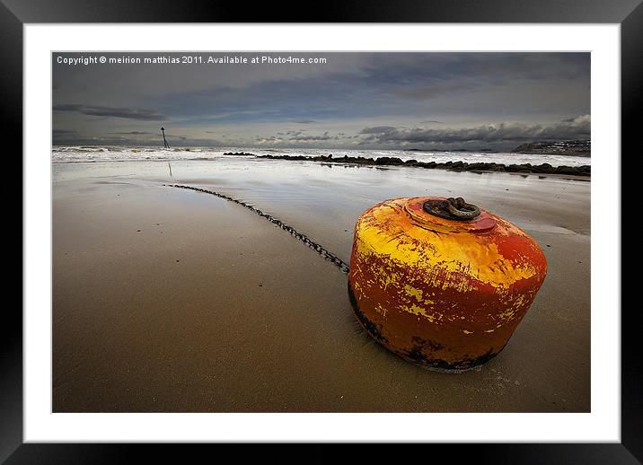 beached mooring buoy Framed Mounted Print by meirion matthias
