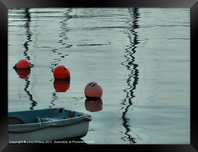 Buoys and reflections Framed Print by Lucy Antony