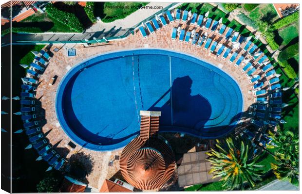 Top down aerial view of hotel swimming pool with crystal blue water  Canvas Print by Alexandre Rotenberg