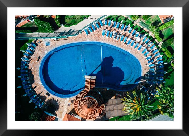 Top down aerial view of hotel swimming pool with crystal blue water  Framed Mounted Print by Alexandre Rotenberg