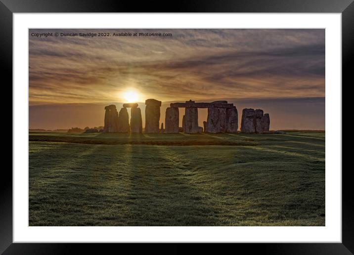 Stonehenge Winter Sunset sun stripes  Framed Mounted Print by Duncan Savidge
