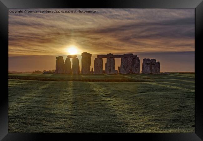 Stonehenge Winter Sunset sun stripes  Framed Print by Duncan Savidge