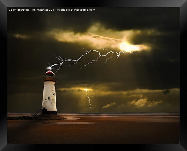 lighthouse and lightning storm Framed Print by meirion matthias