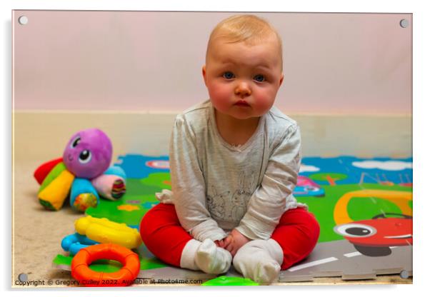 A baby girl sitting on a colourful mat with her toys Acrylic by Gregory Culley