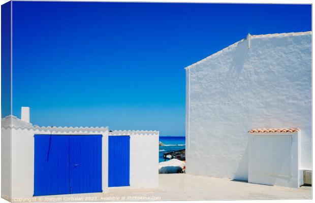 Fisherman's hut with white walls and colorful blue wooden doors  Canvas Print by Joaquin Corbalan