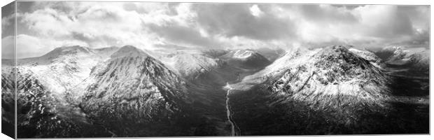 Glen Etive valley skyfall road in winter snow scottish highlands black and white Canvas Print by Sonny Ryse
