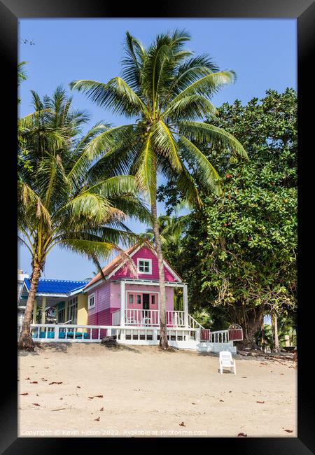 Pink Bungalow on the beach Framed Print by Kevin Hellon