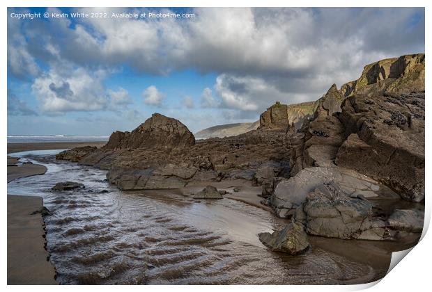 Weather worn rocks at Sandymouth Bay Print by Kevin White