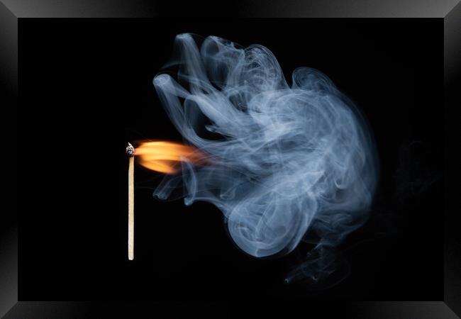 Burning match with smoke and flames Framed Print by Bryn Morgan