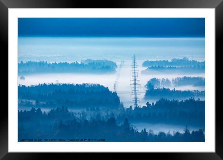 Electricity pylons in the mist. Framed Mounted Print by Ian Middleton