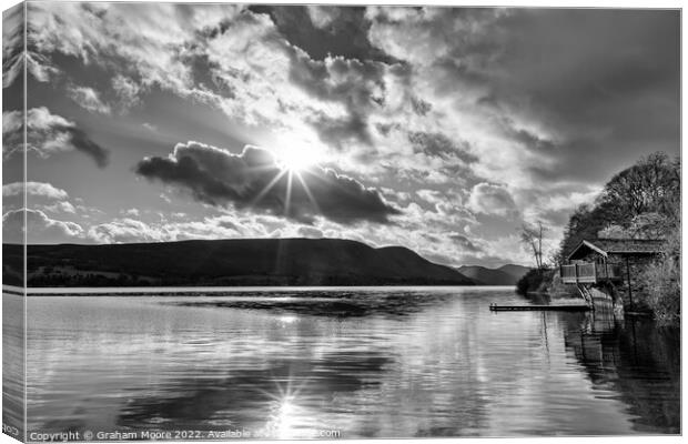 Ullswater boathouse with sun flare monochrome Canvas Print by Graham Moore