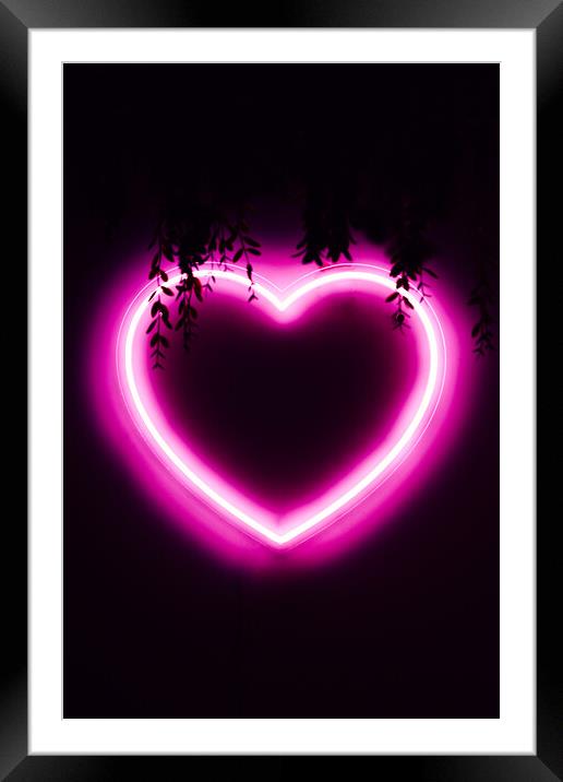 Neon pink heart on black wall Framed Mounted Print by Alexandre Rotenberg