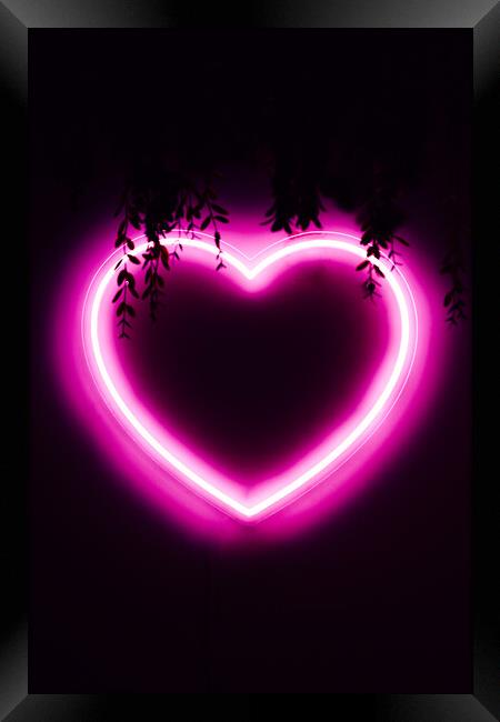 Neon pink heart on black wall Framed Print by Alexandre Rotenberg