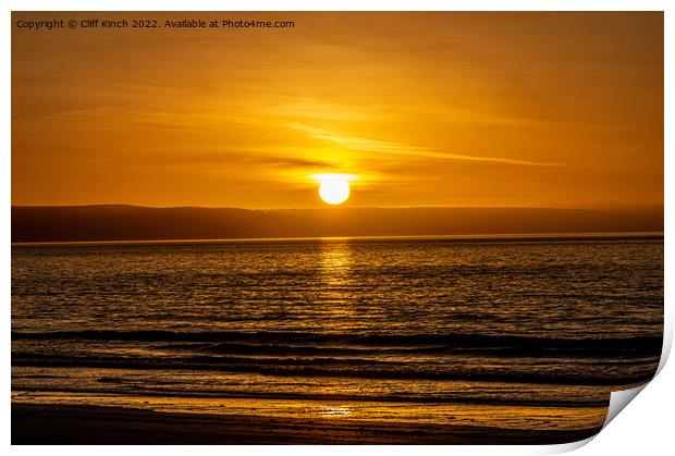 Sunset over the beach Print by Cliff Kinch