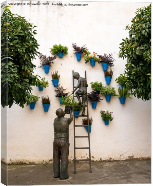 Wall art in Cordoba Canvas Print by Jo Sowden