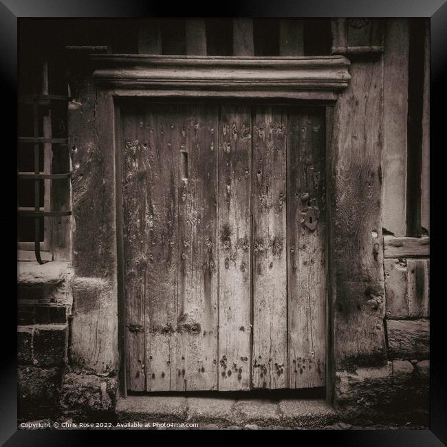 Ancient weathered wooden doorway Framed Print by Chris Rose
