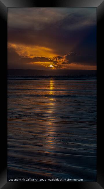 Long strands of sunset across the beach Framed Print by Cliff Kinch