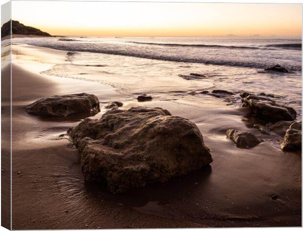 Sunrise on Oura Beach shoreline Canvas Print by Tony Twyman