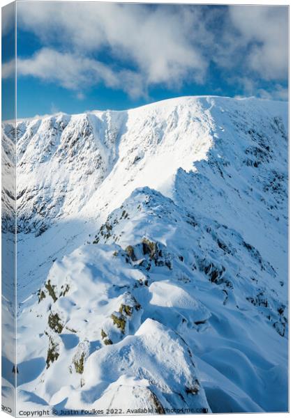 Striding Edge, in winter, Helvellyn Canvas Print by Justin Foulkes