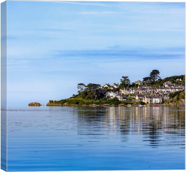 Calm early summer conditions create a pleasing reflection of the village of Borthygest. Canvas Print by David Thurlow
