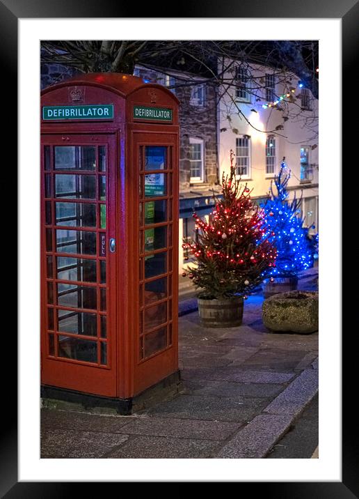 Red telephone box at Christmas Framed Mounted Print by kathy white