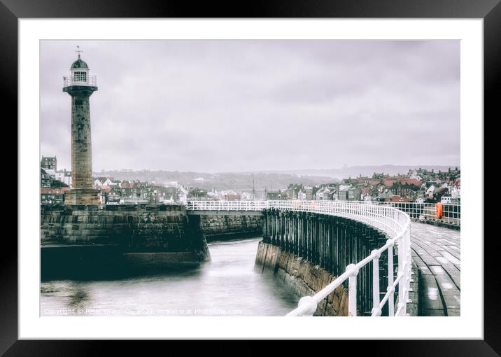 The Harbour Lighthouse & Curved Pier At Whitby On A Cold Winters Framed Mounted Print by Peter Greenway
