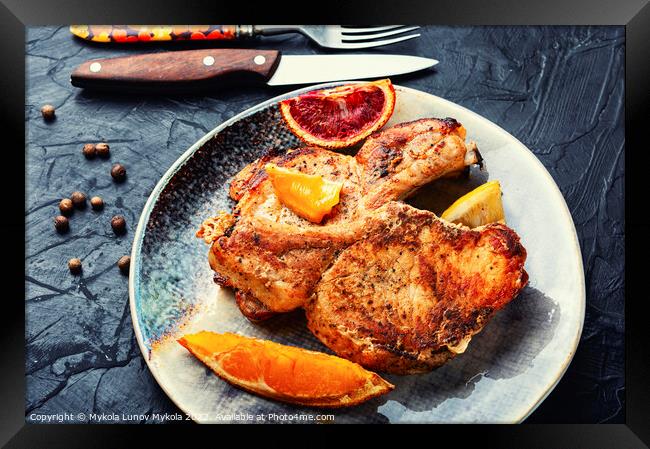 Roast pork chop meat in orange sauce Framed Print by Mykola Lunov Mykola