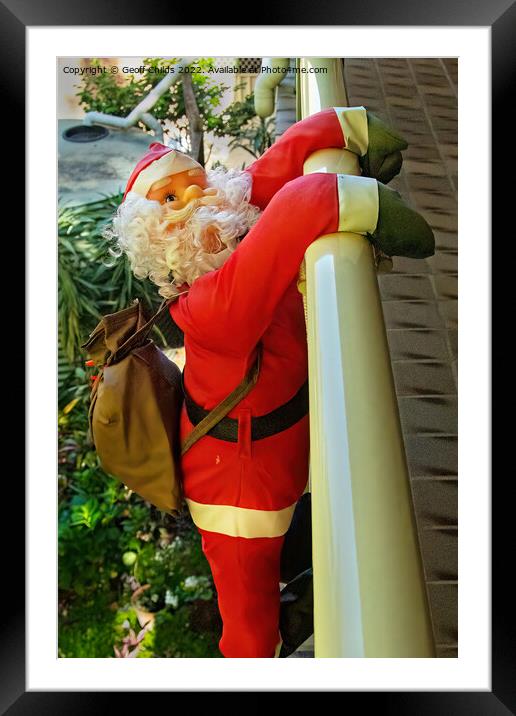  Christmas theme image with Santa climbing over a balcony. Framed Mounted Print by Geoff Childs