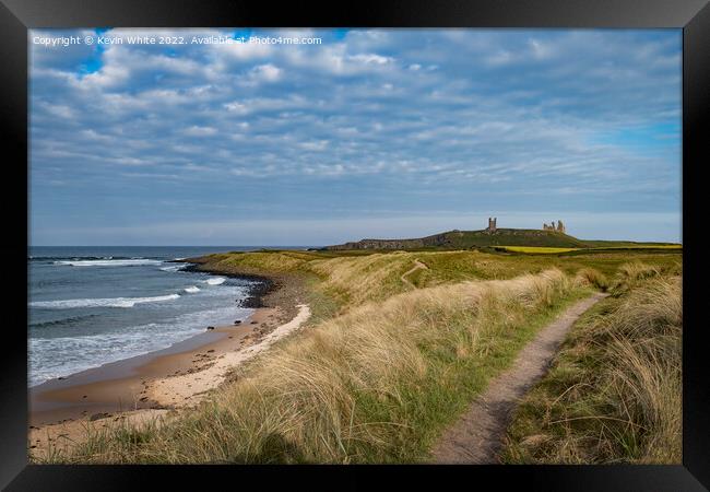 Evening stroll along path at Embleton beach Framed Print by Kevin White