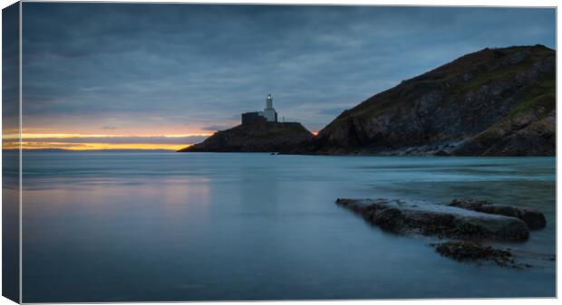 Mumbles lighthouse at day break Canvas Print by Bryn Morgan