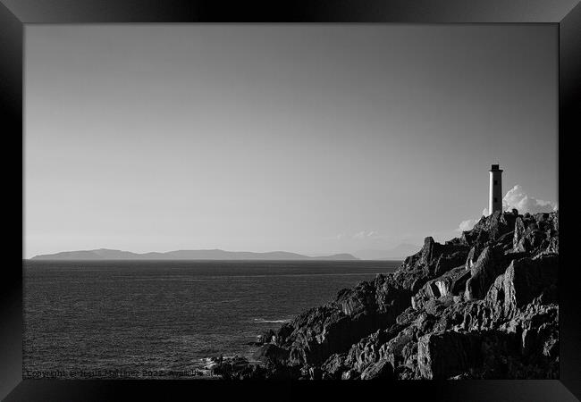 A Majestic Lighthouse on Cliffs Framed Print by Jesus Martínez