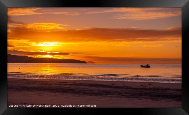 Majestic Winter Coastal Sunset Framed Print by Rodney Hutchinson