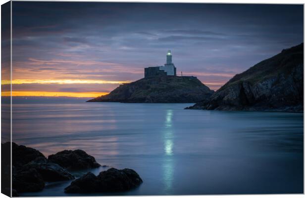 Mumbles lighthouse at dawn Canvas Print by Bryn Morgan