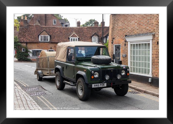 Landrover Defender pulling truck with a bale of hay, Framed Mounted Print by Kevin Hellon