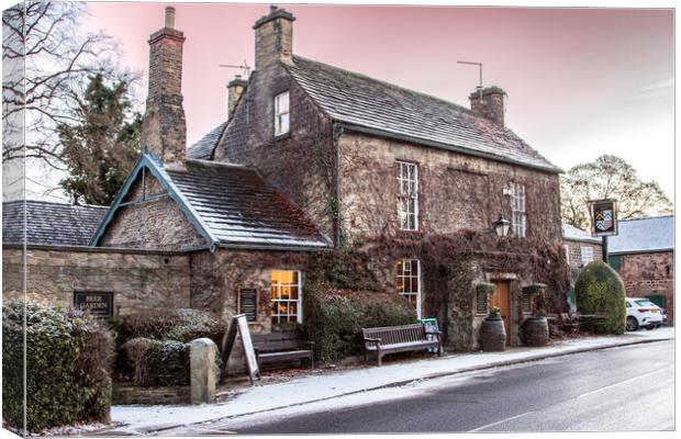 The Rockingham Arms In the Snow Canvas Print by Apollo Aerial Photography