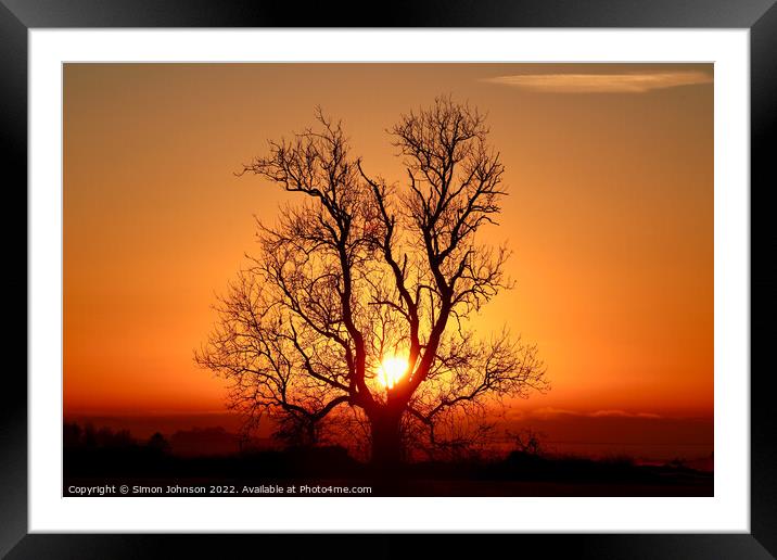 A sunset over a body of water Framed Mounted Print by Simon Johnson
